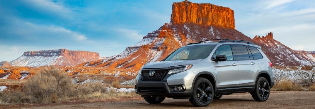 Silver 2021 Honda Passport in a Desert with Snow