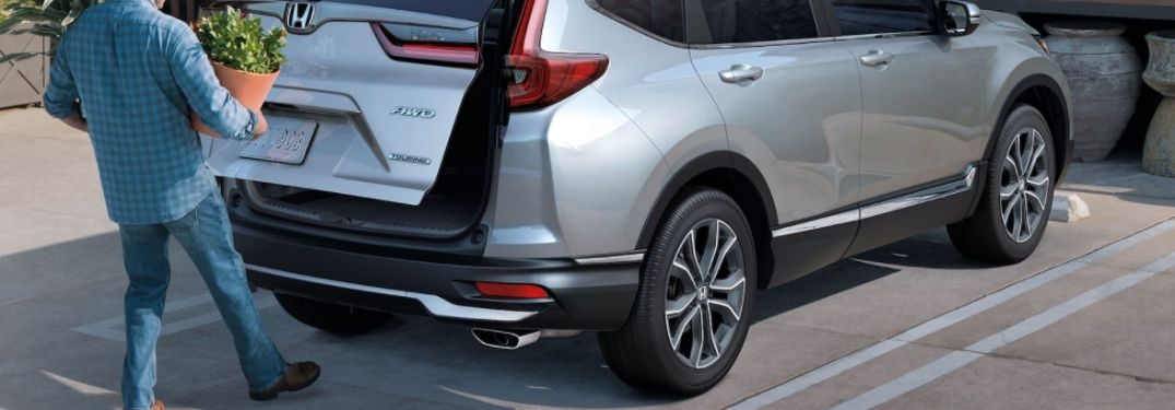 Man Using the Hands-Free Power Liftgate on a Silver 2021 Honda CR-V
