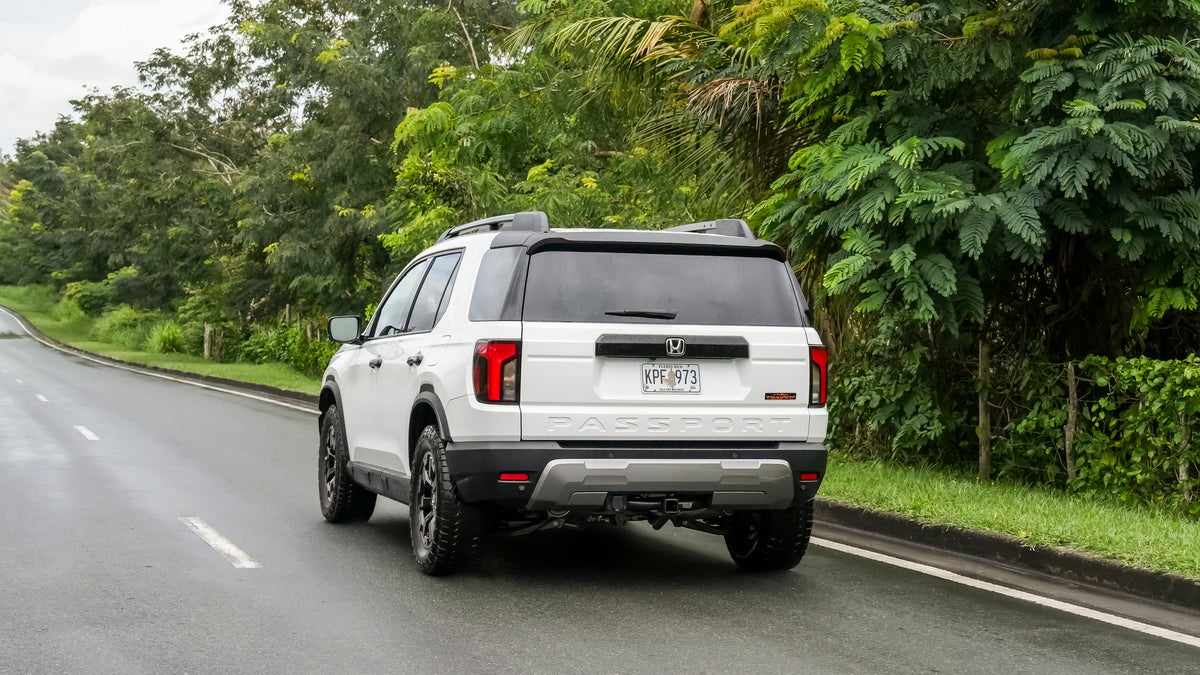 A close-up view of the rear hatch, taillight, and shark fin antenna on a gray Honda HR-V.